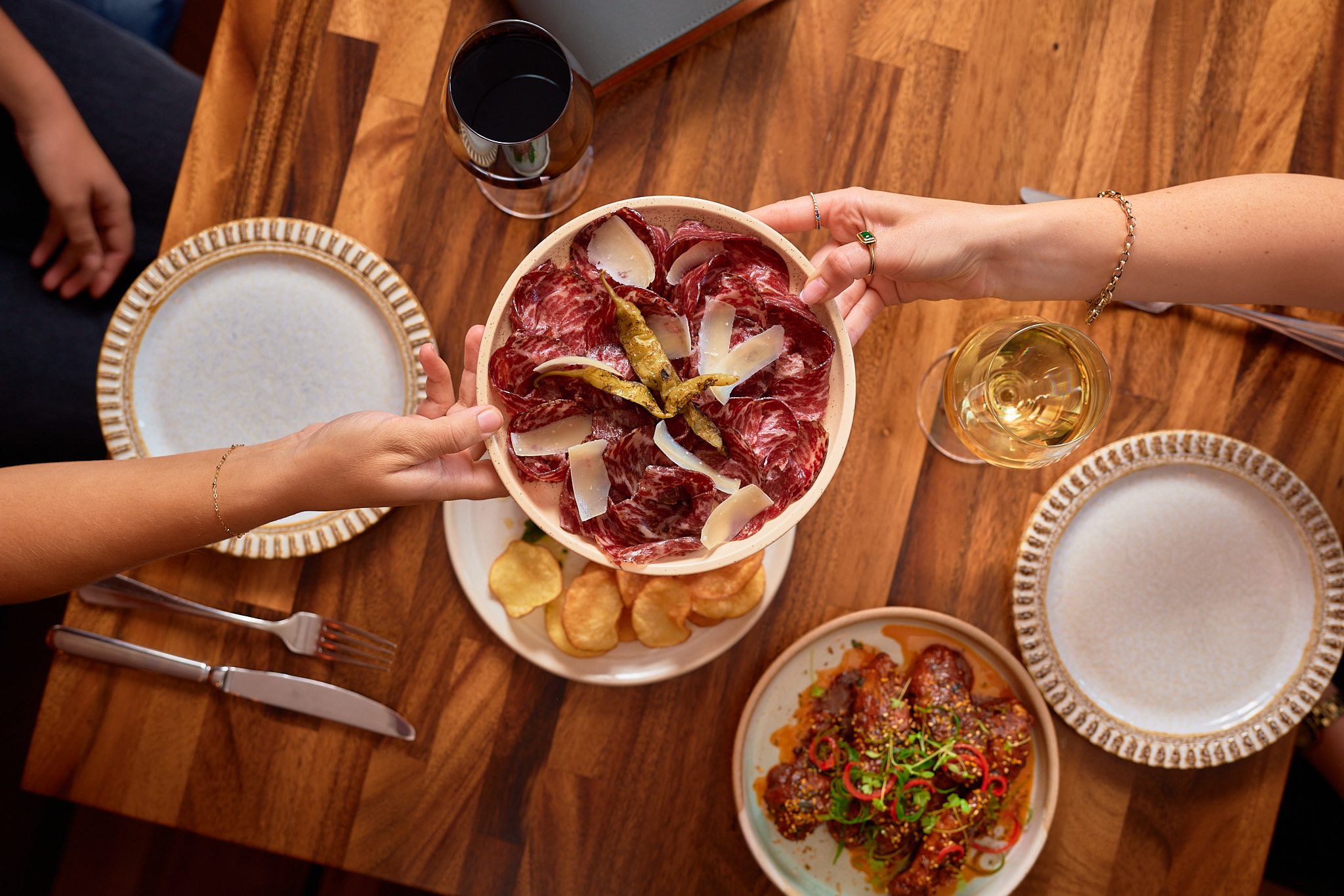 Shared table with charcuterie and wine